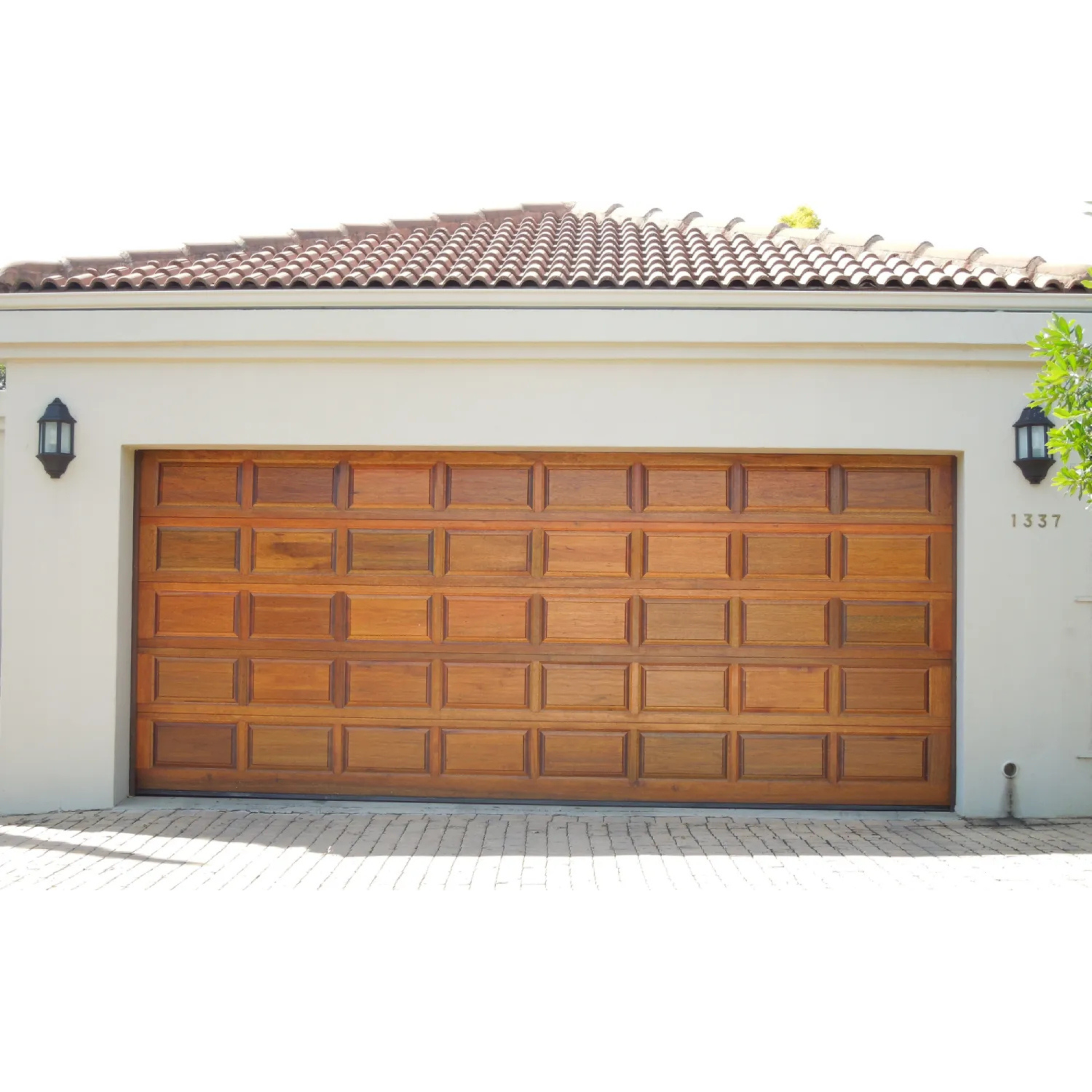 Timber sectional garage door with premium wood panel designs including raised panel, brick and Tuscan styles for single and double garage installations.